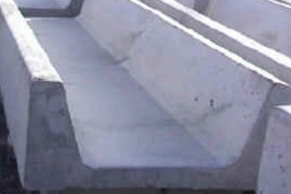 Closeup view of small concrete fence line yard bunk