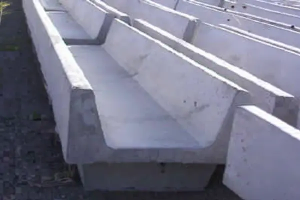 Closeup view of small concrete fence line yard bunk