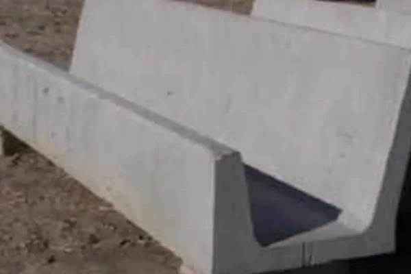 Closeup view of concrete fence line yard bunk straight back