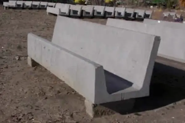 Closeup view of concrete fence line yard bunk straight back