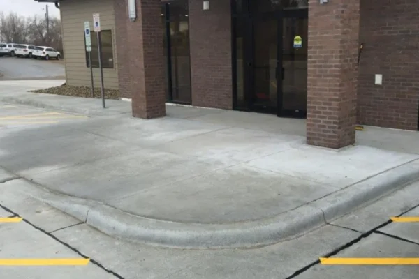 Concrete curb and gutter construction