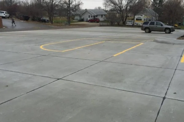 Concrete construction for driveways and parking lots